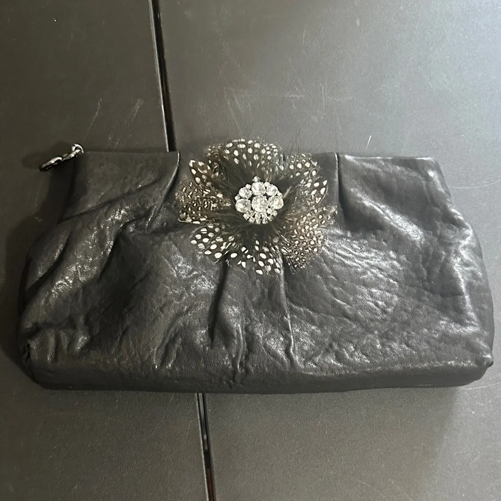 Stella & Dot black leather with feather CZ accent clutch bag